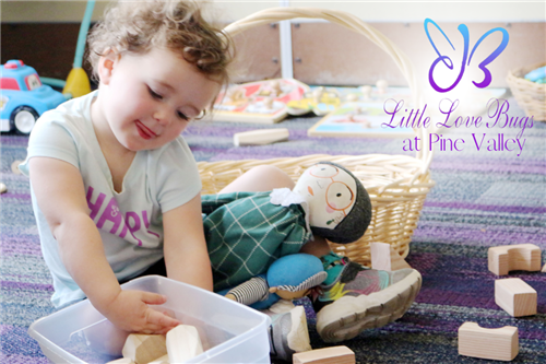 child plays with blocks