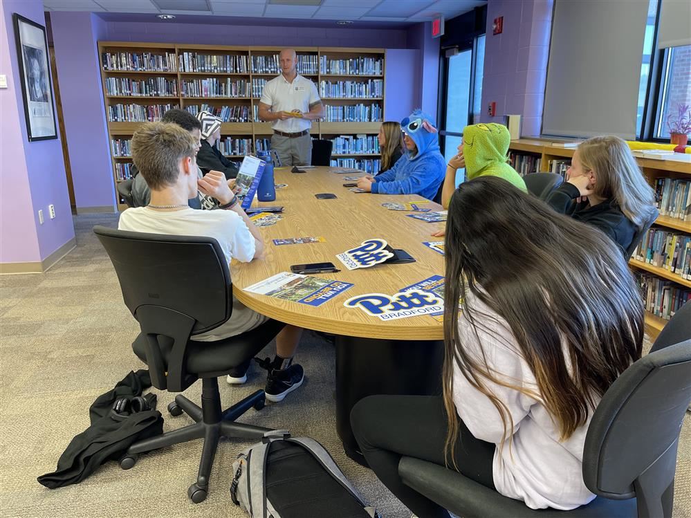 Students meeting with a college representative