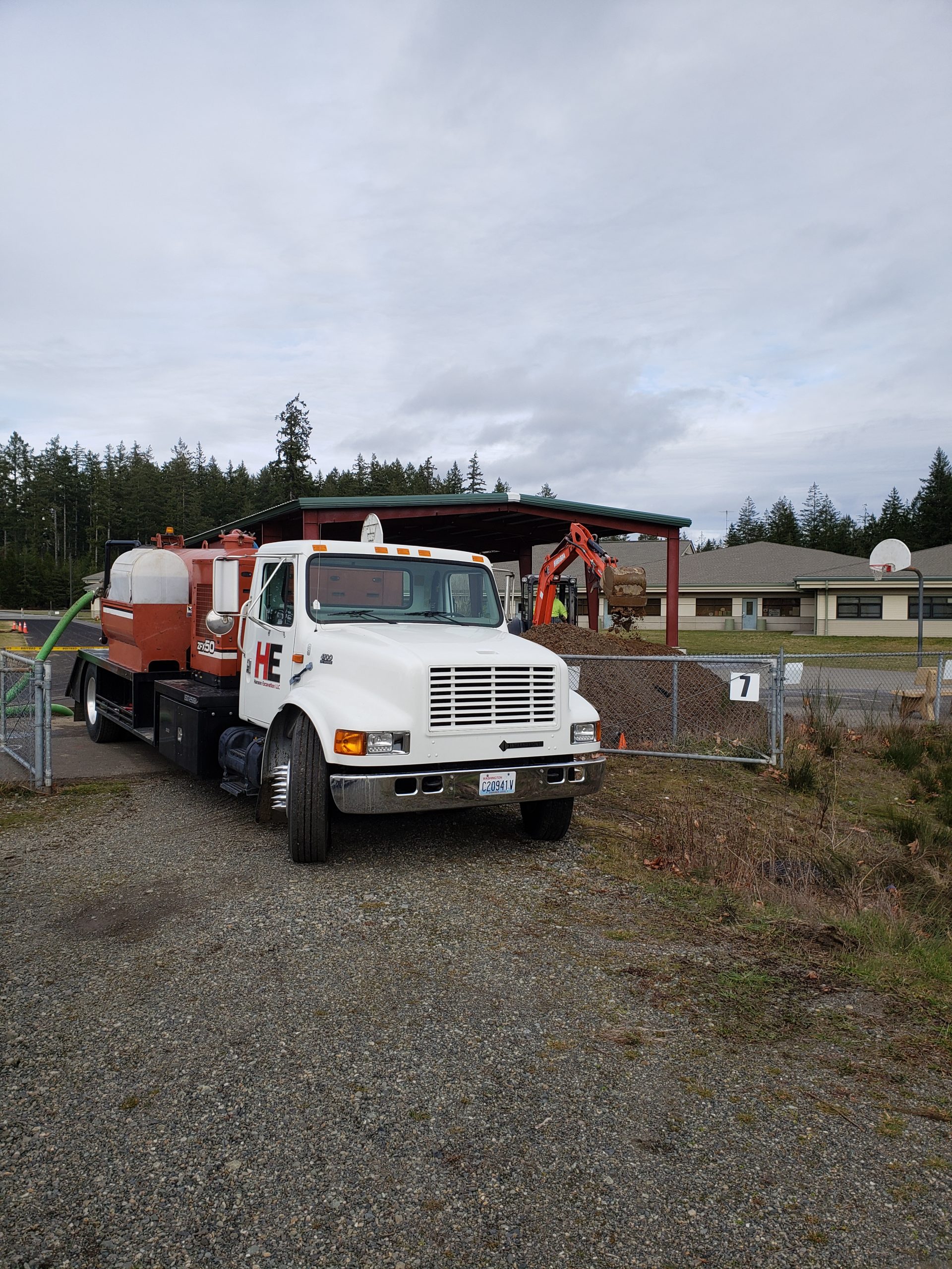 An HE truck parked by the basketball court at Pioneer Elementary.