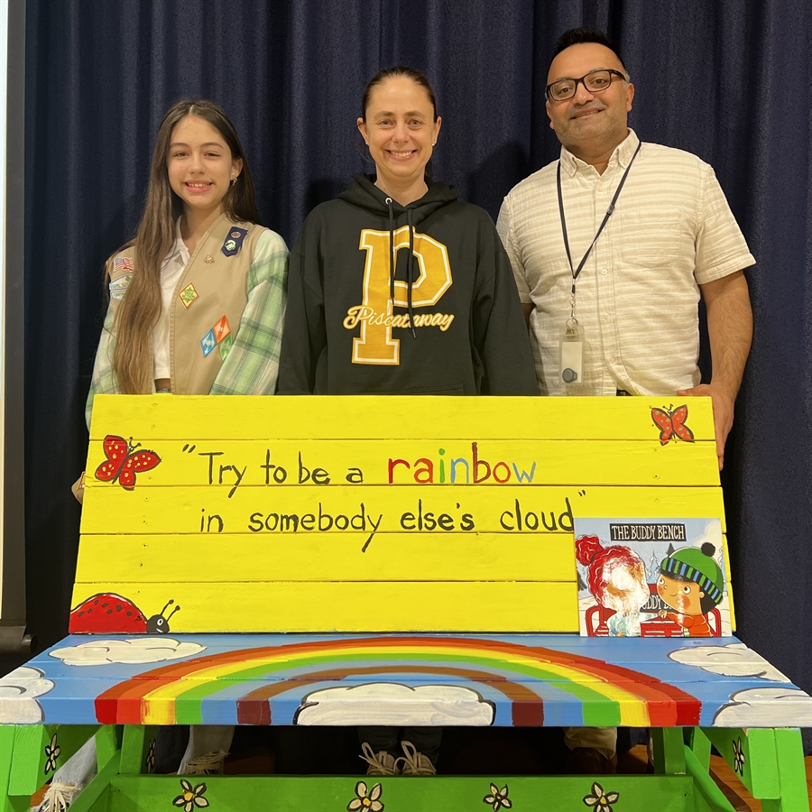 girl scout, mother, principal behind bench