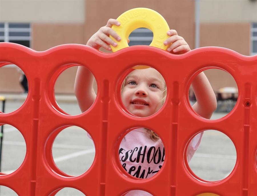 child playing connect four