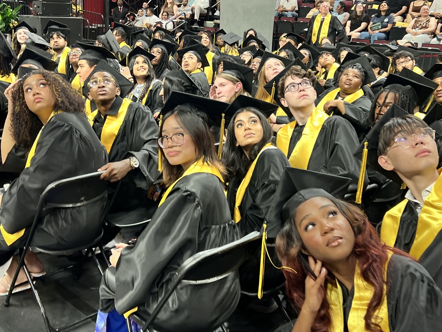 graduates watching video