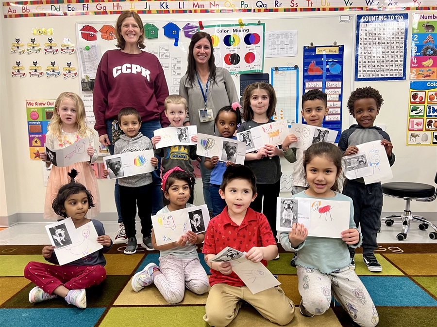 preschool class holding drawings