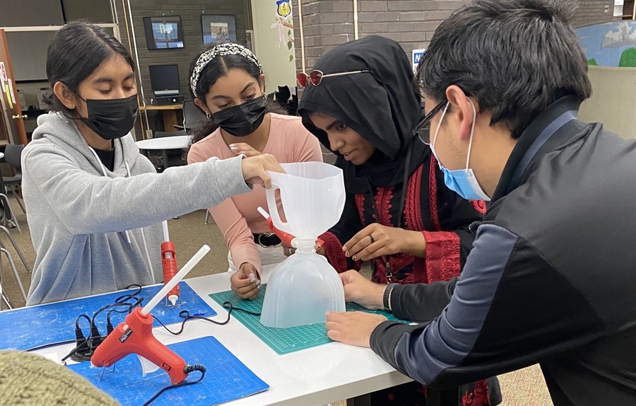 students creating lantern fly traps