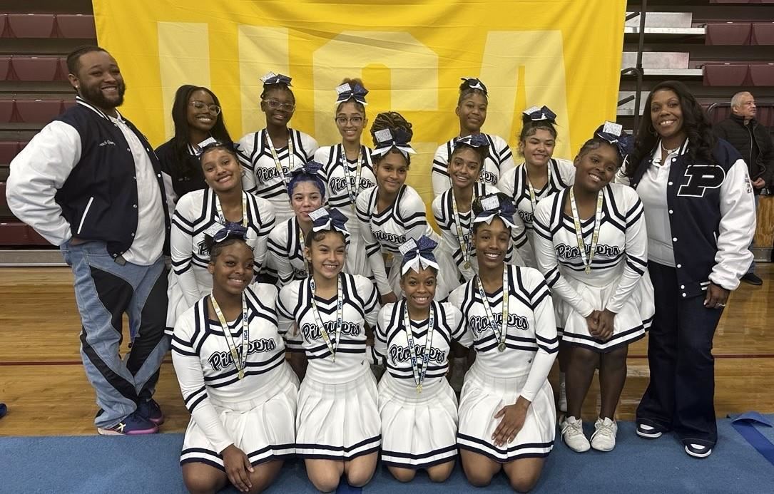  The Poughkeepsie High School cheerleading team and coaches pose together 