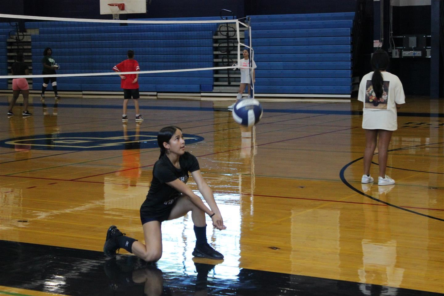 Natalia Lopez bumps a volleyball
