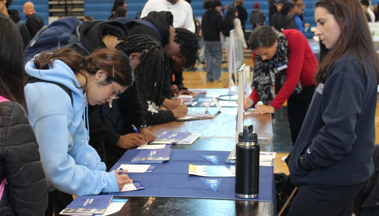 Students fill out college forms