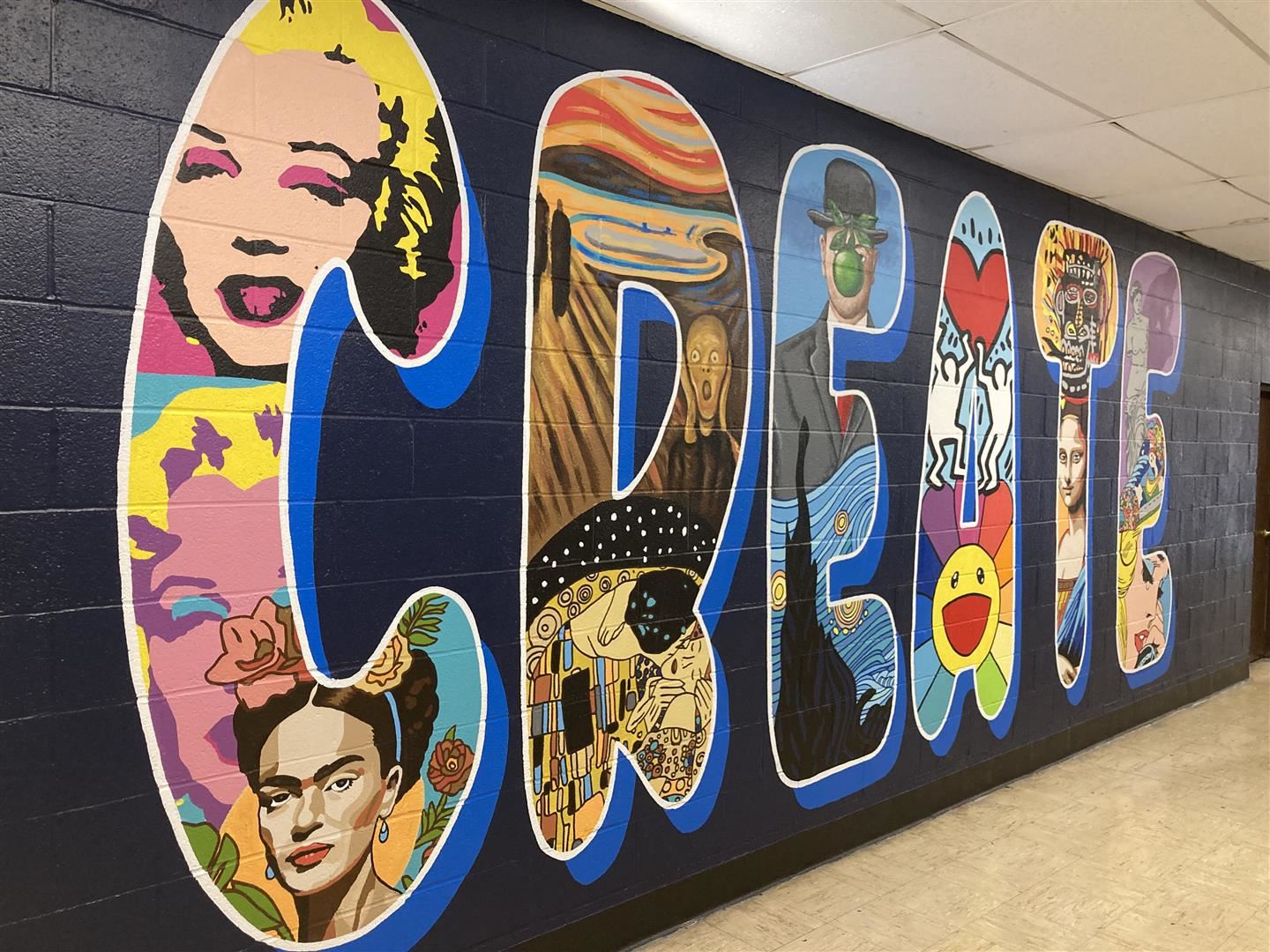 A mural features artwork within the letters of the word "Create"