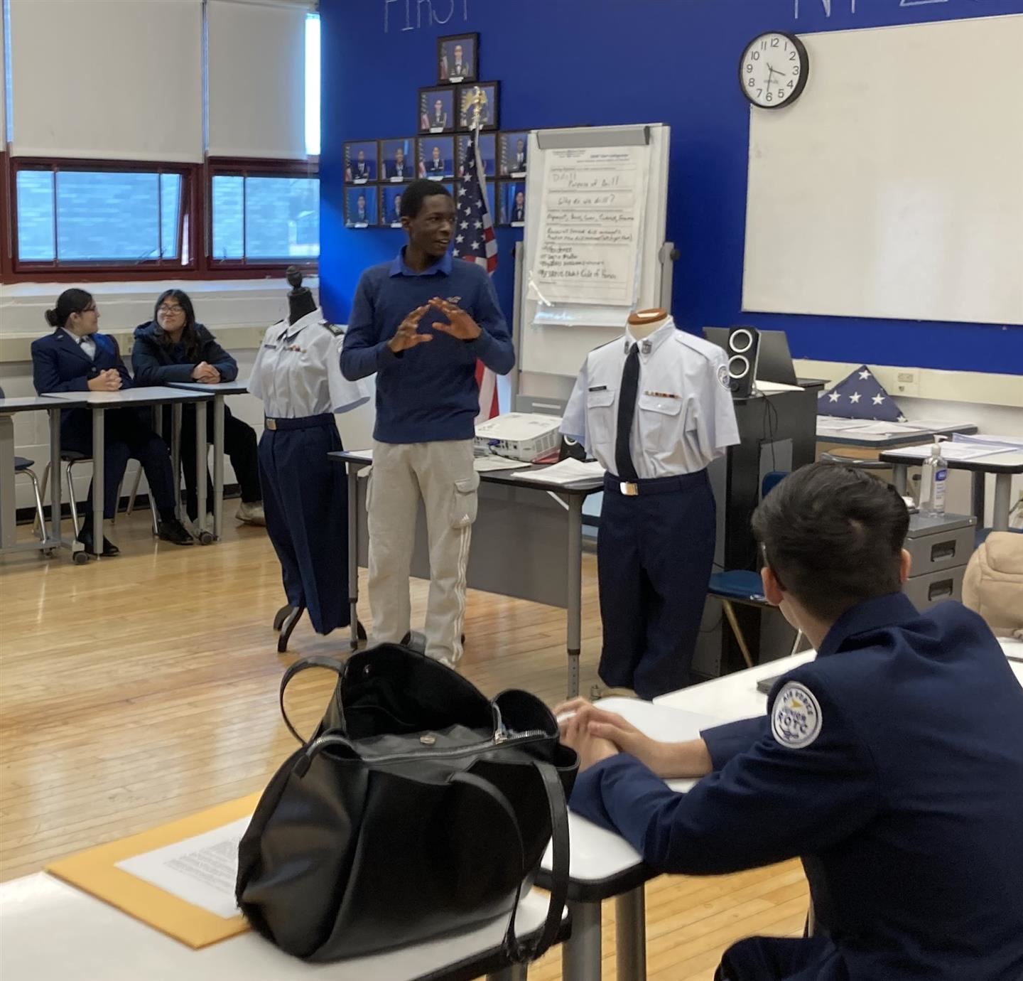 Cadet 2nd Lt. Milton Kamura, a sophomore, talks to the Aviation Club members.