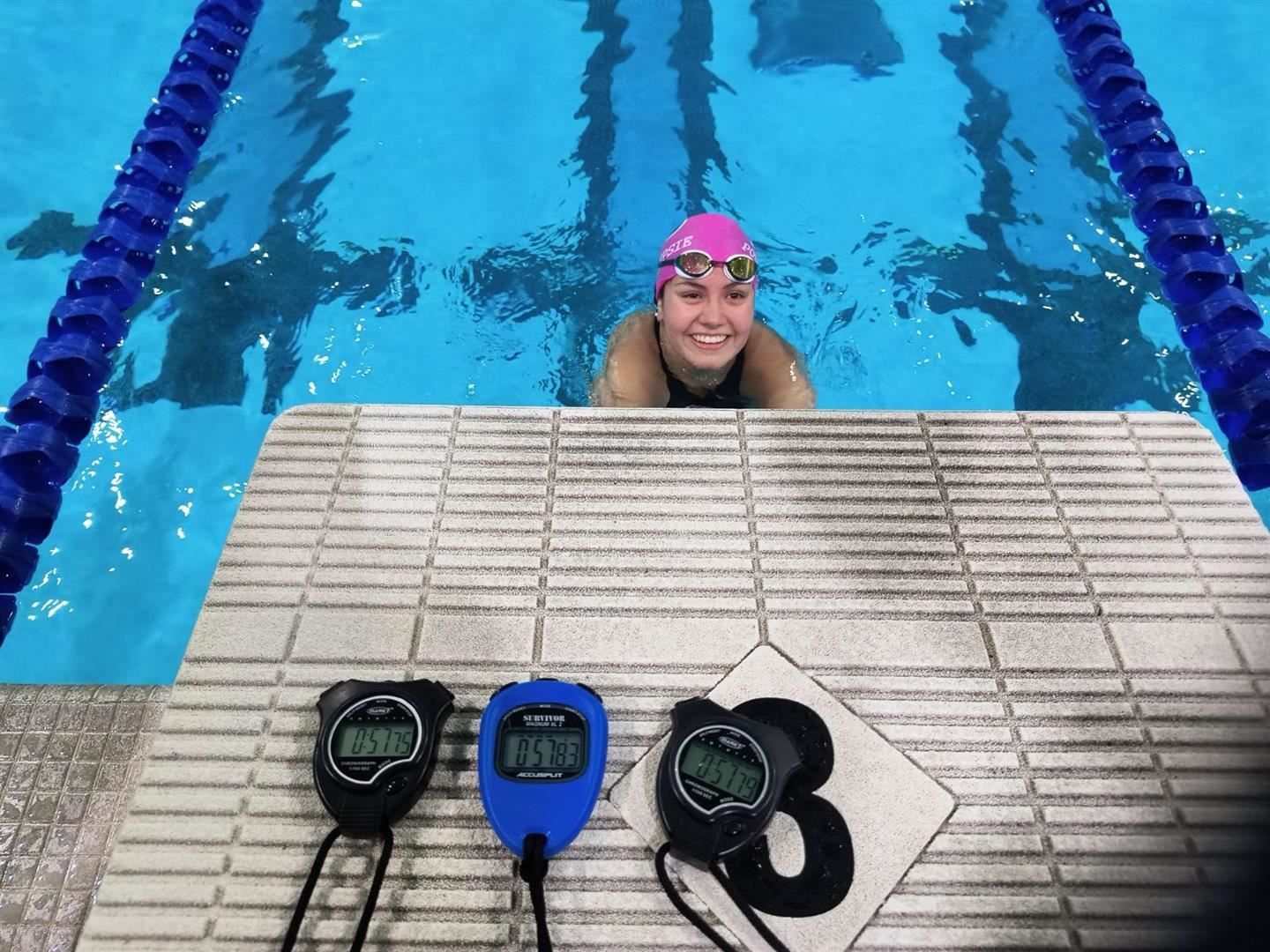  Renata Martinez poses after she set the school record for the 100-freestyle