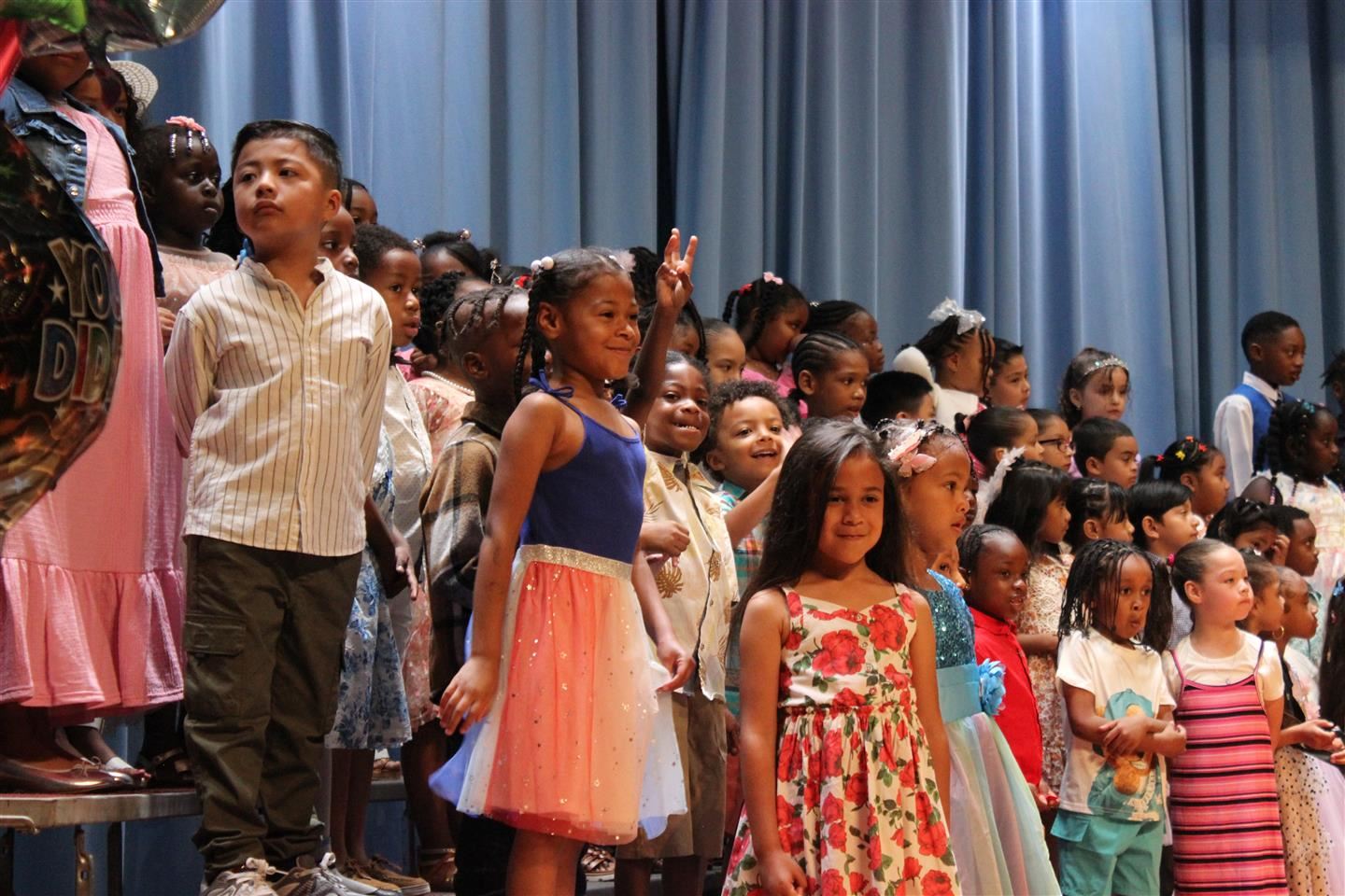Kindergarteners stood on risers at Poughkeepsie Middle School