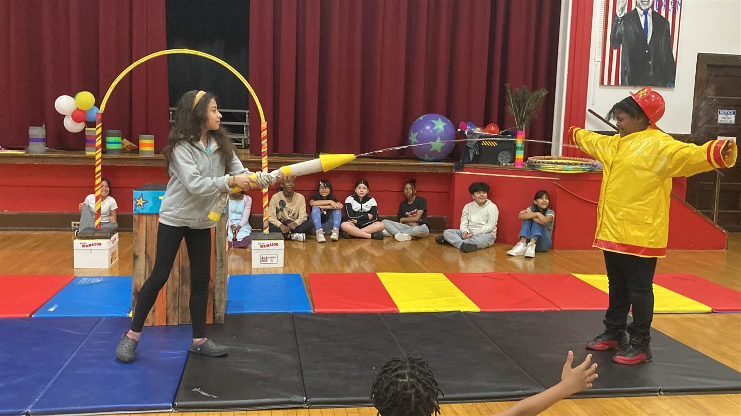  A student hits another student with water