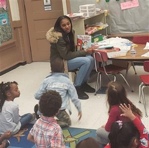 A student from PHS' E-Tech program reads to students at ELC 