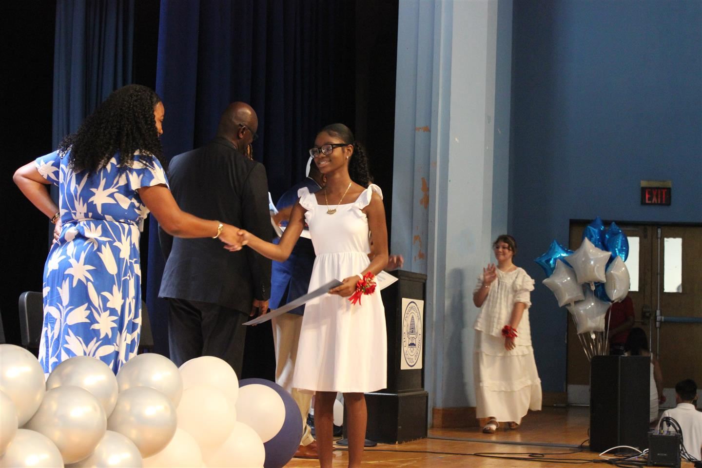  Rhianna Bramwell receives her certificate at Clinton Elementary’s fifth-grade moving up ceremony