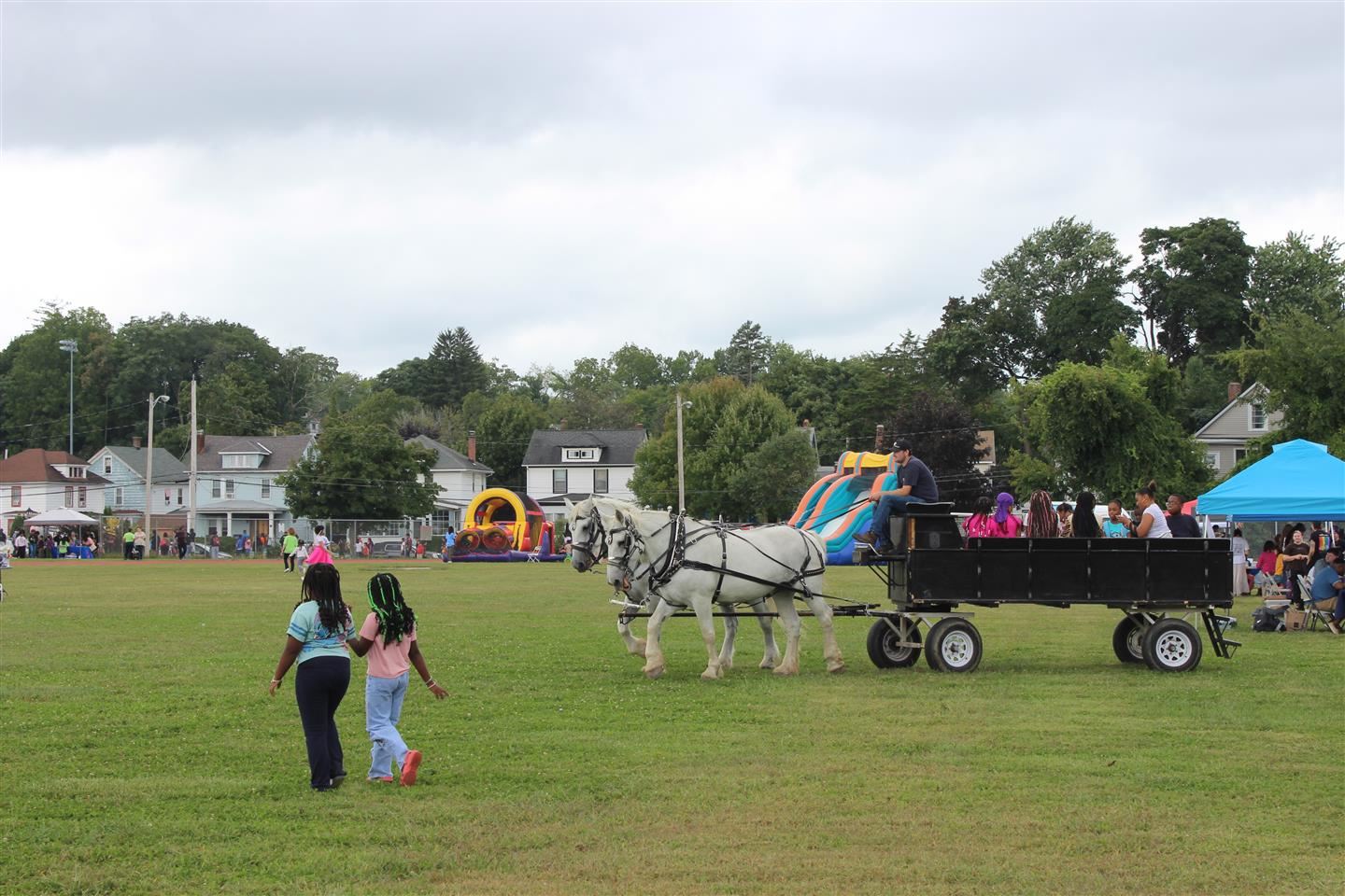 Horse-drawn hayride crosses the Poughkeepsie High School field