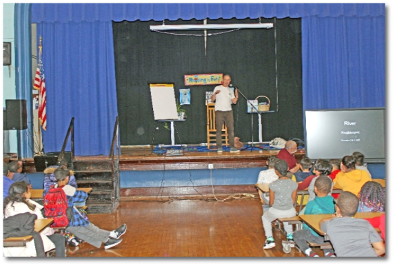 Cooper speaks to students. 