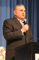 Robert Parkes speaks into a microphone