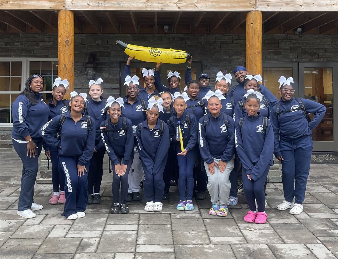  Poughkeepsie's cheerleading team poses with The Banana trophy