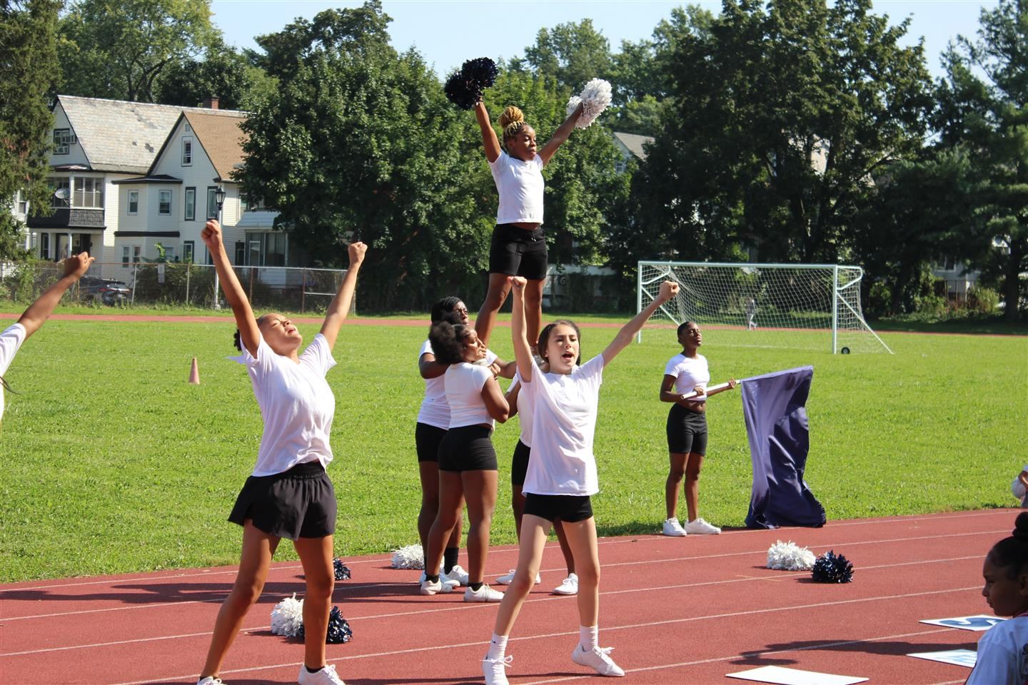 Poughkeepsie cheerleaders practice on the high school track