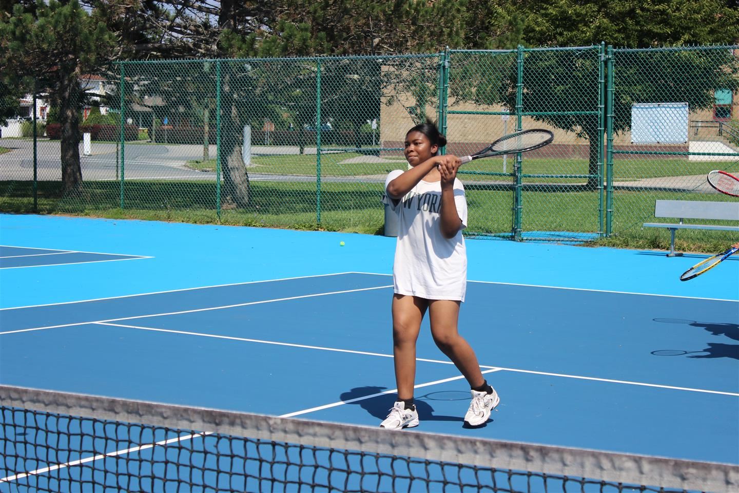 Serenity Barcelona hits a tennis shot