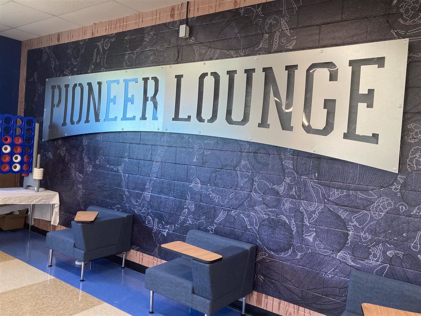 The Pioneer Lounge sign on a wall