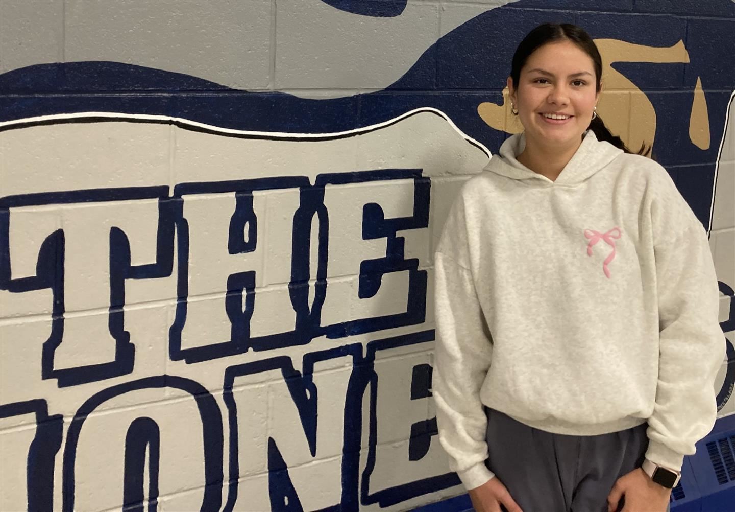 Renata Martinez poses against a wall at Poughkeepsie High School