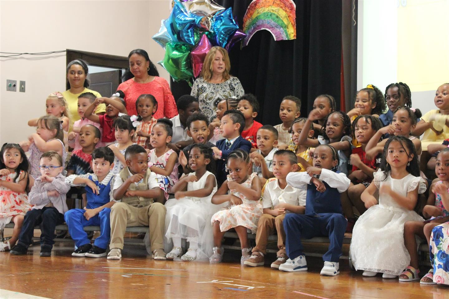  Early Learning Center pre-K students perform at a moving up ceremony