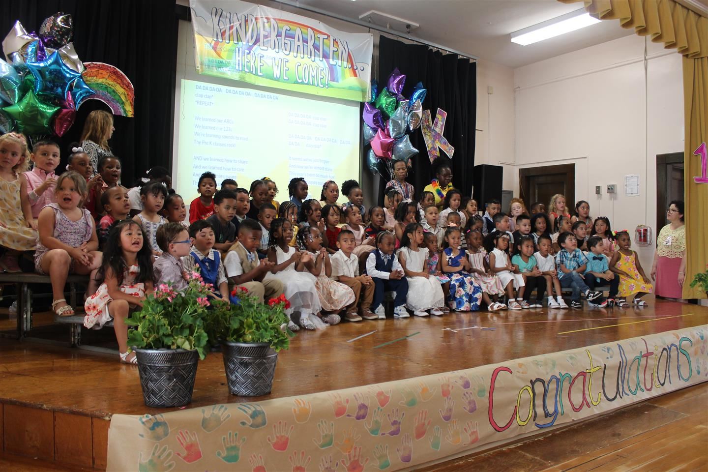  Early Learning Center pre-K students perform at a moving up ceremony