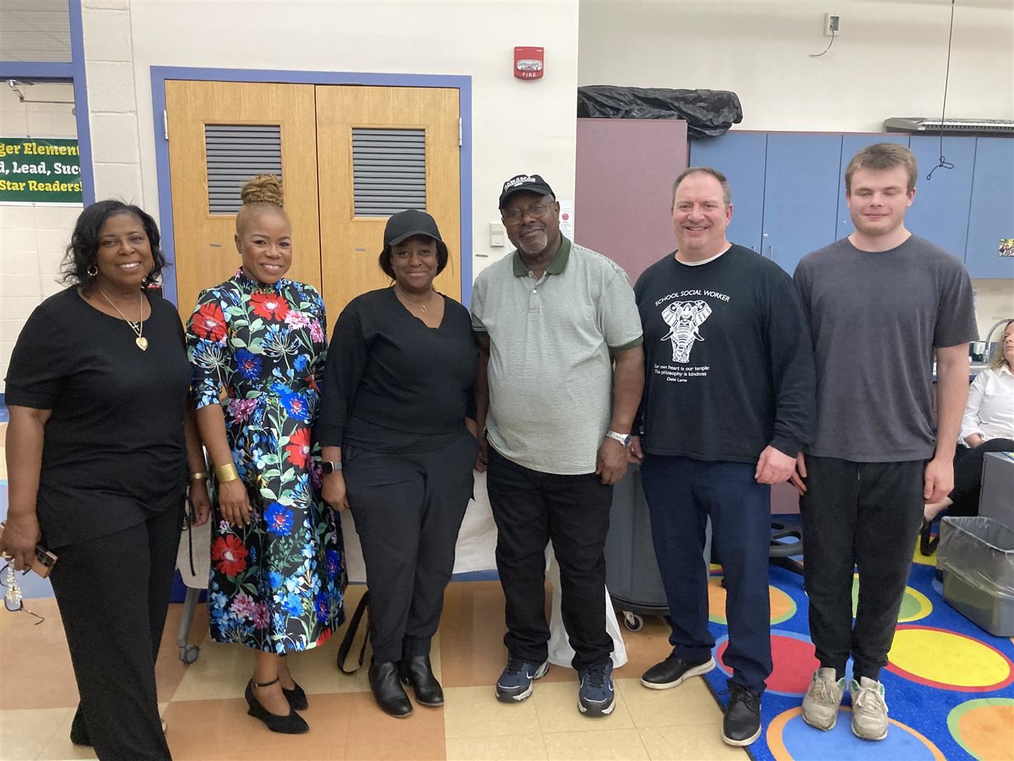Six people responsible for the chess program stand side-by-side