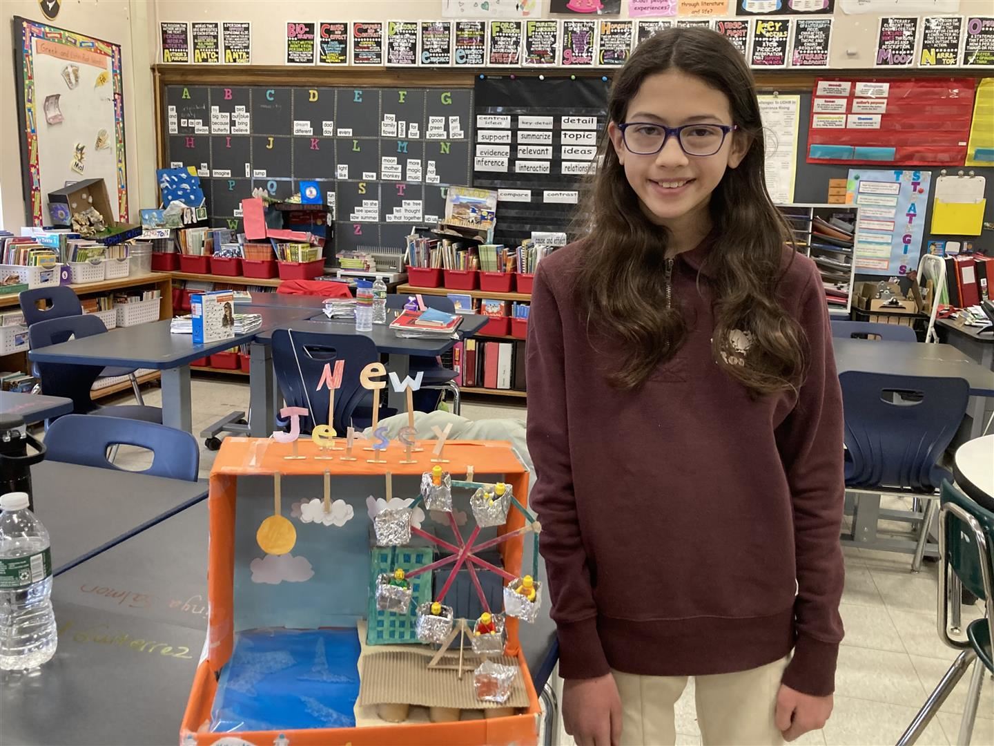  Lara Topaloglu stands with a project on the New Jersey shore.