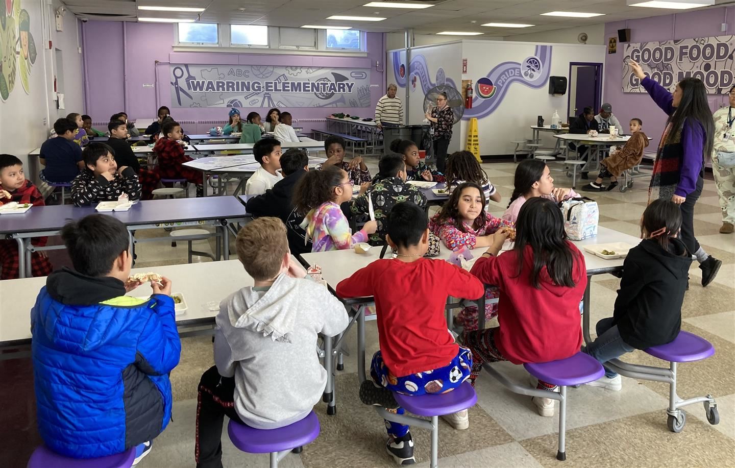 Students eat lunch in a school cafeteria