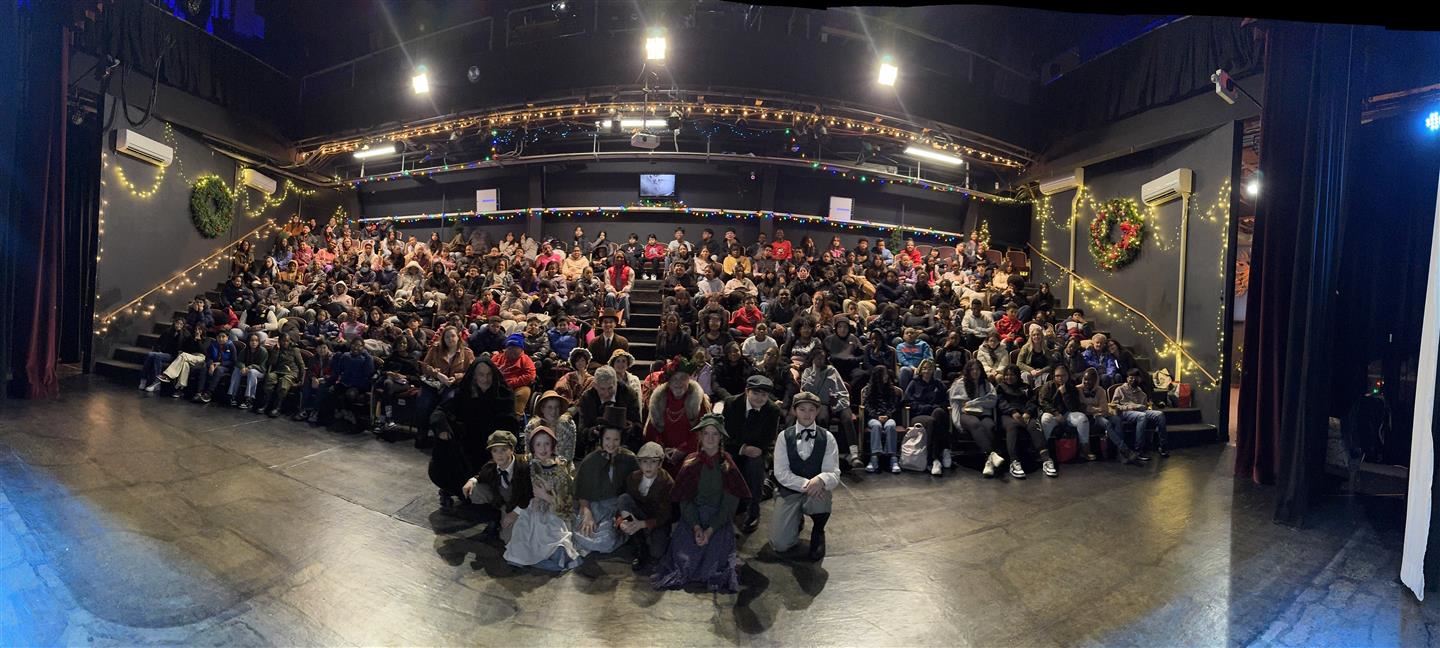  Poughkeepsie Middle School students and the ‘A Christmas Carol’ cast pose together for a photo.