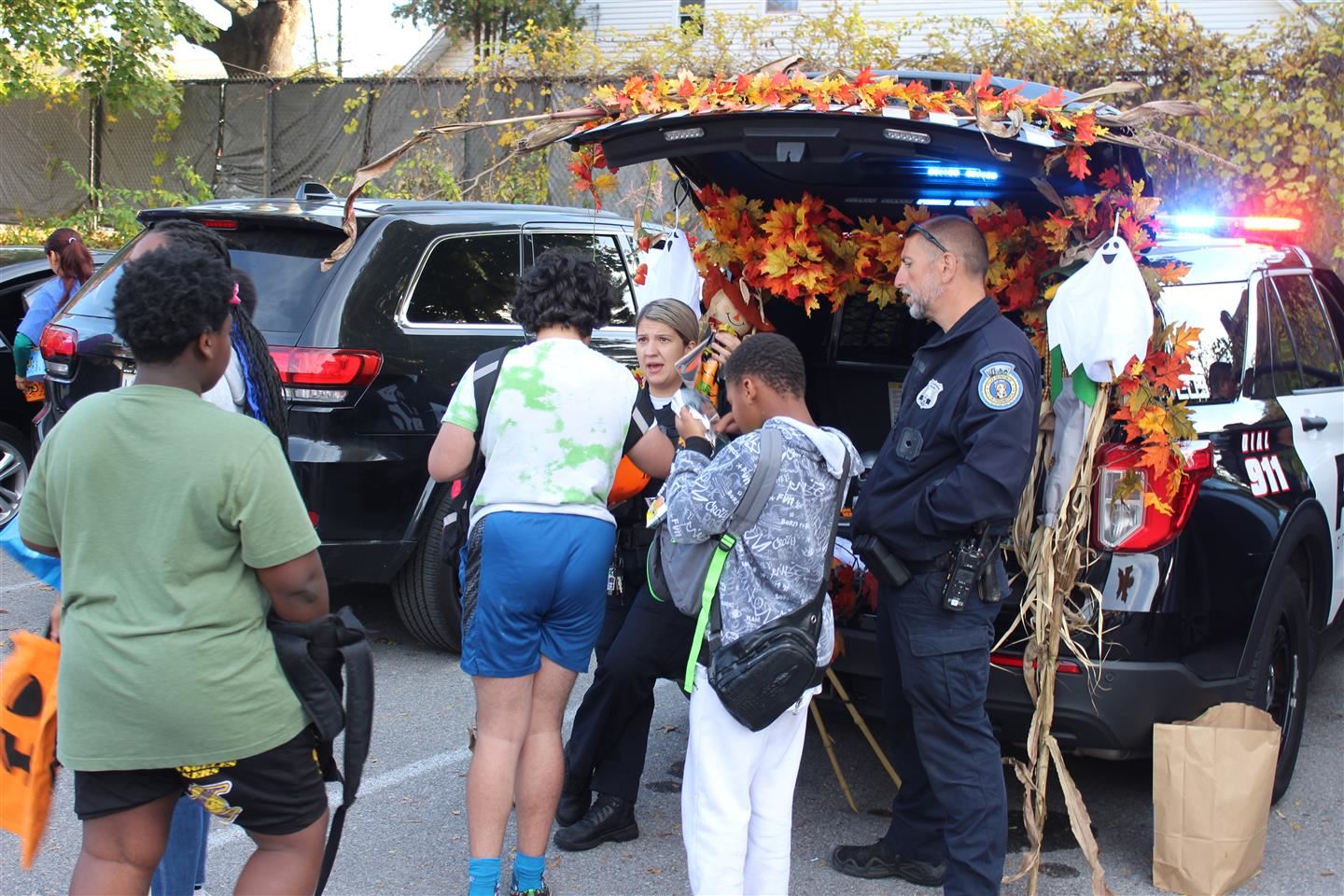 Police hand out candy at the Trunk or Treat