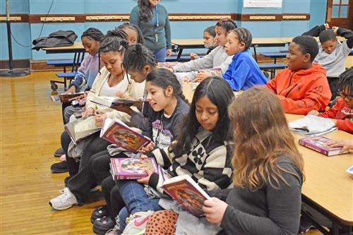 Some Clinton students couldn&rsquo;t wait to get into their copy of &ldquo;Nic Blake and the Remarkable: The Manifestor Prophecy.&rdquo;