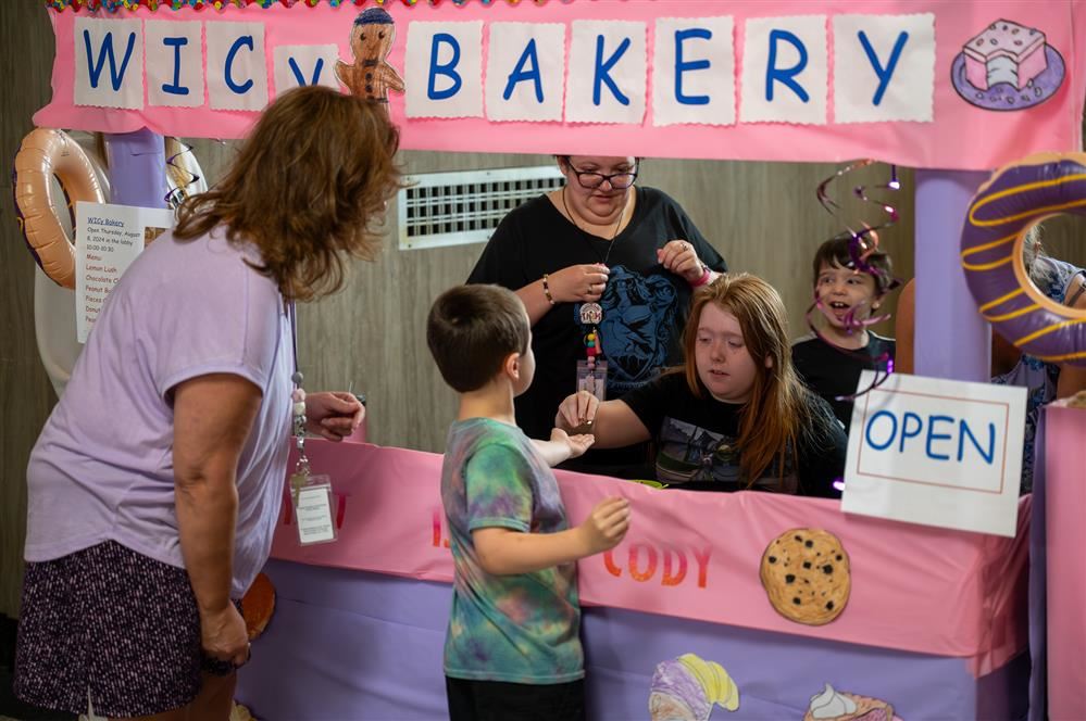  Students at Lura Sharp shopping at the ESY bakery.