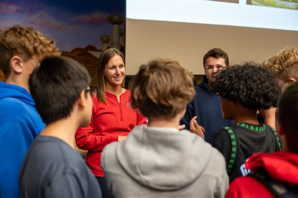  Students talking with Jessica Pastuf after her recent presentation at Pulaski Middle-High School.