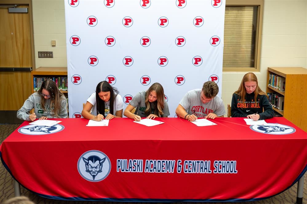  Students at Pulaski High School signing their letters of intent to play a collegiate sport.