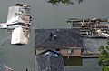 Residents on roof of flooded house