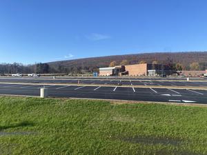 The expansive new lot in front of the high school.