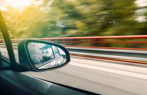 Looking out of a car window at road