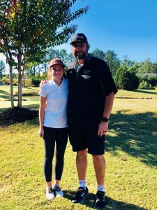Female golfer and coach