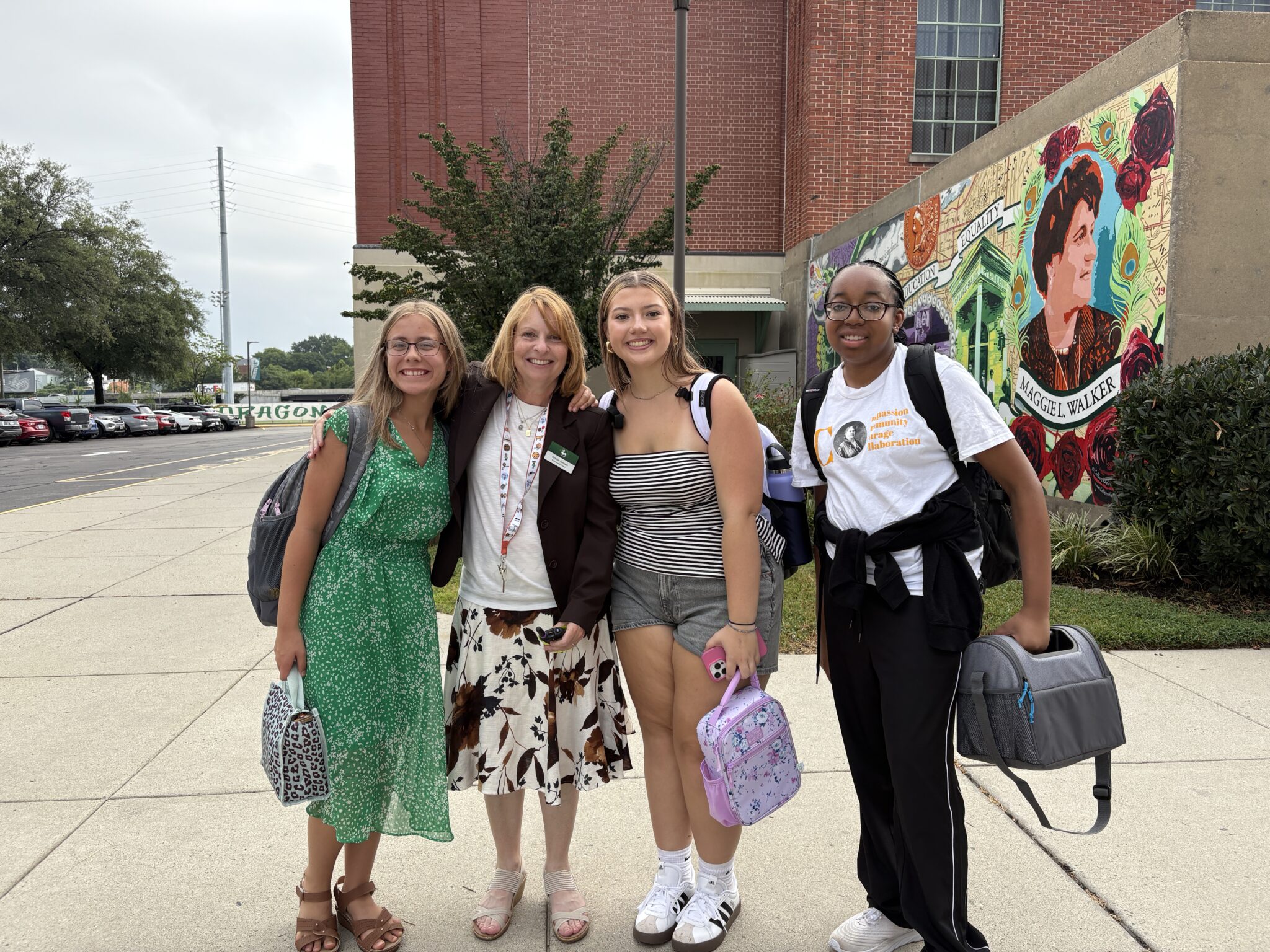 School Ex Dir with 3 students