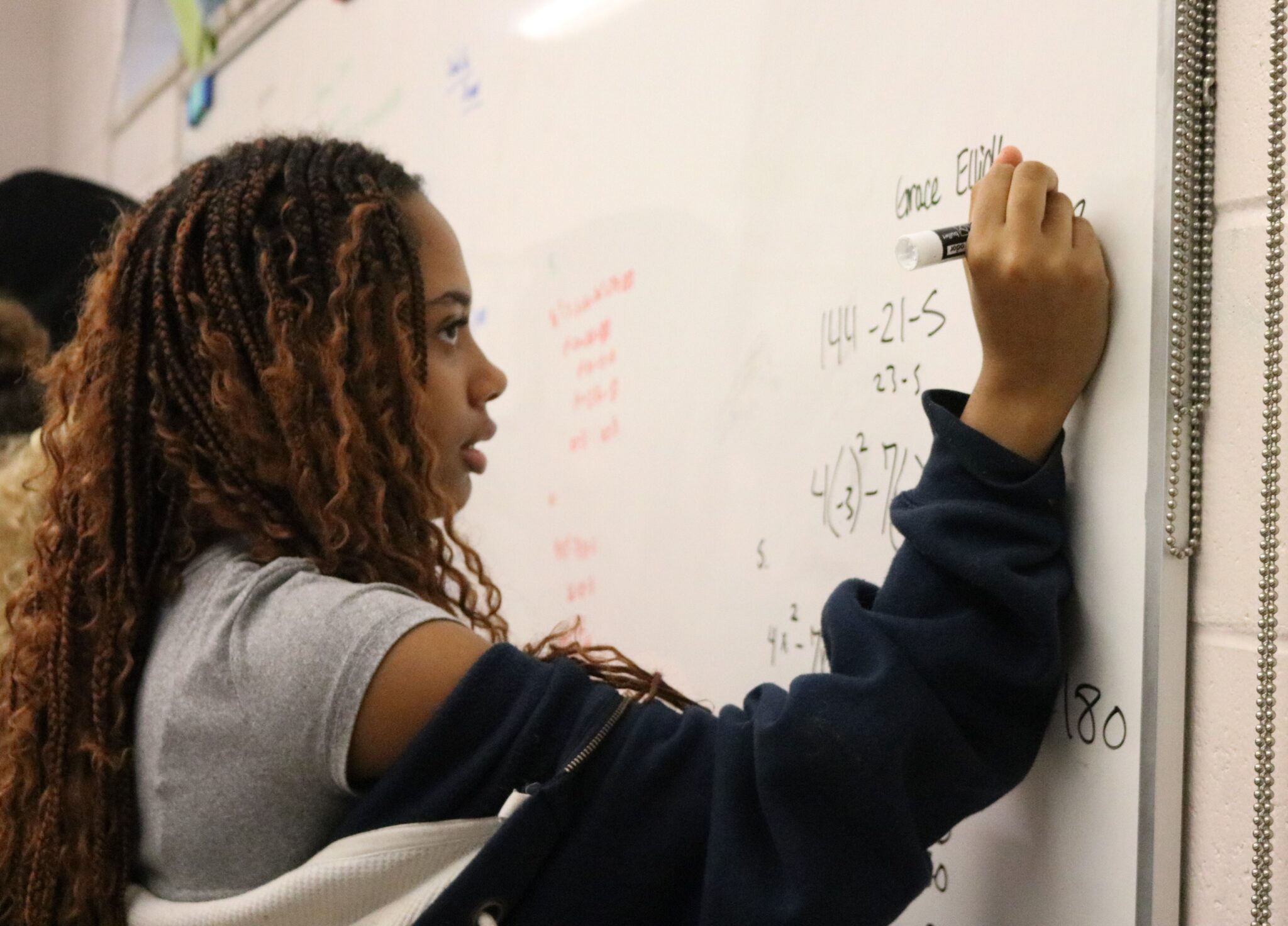 Student working at board