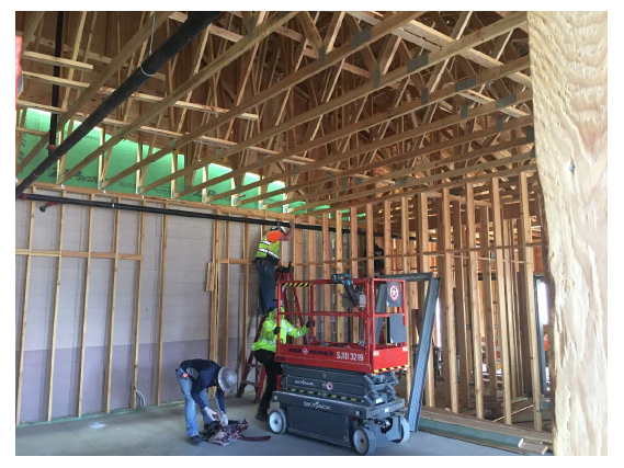 construction workers inside high school building construction workers inside high school building
