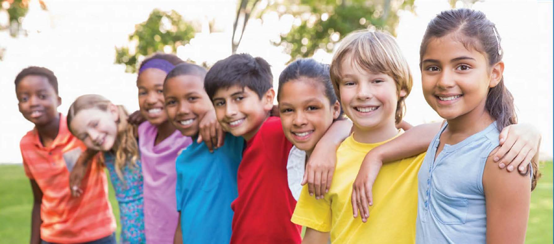 Group of diverse children standing with arms around each others' shoulders