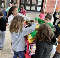 JAE 3rd graders planting flower boxes. thumbnail258585