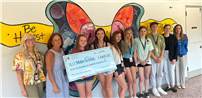 Students and teachers holding large check. thumbnail267178