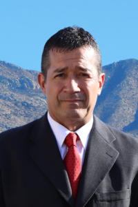 Raul Rodriguez standing in front of moutian and sky background
