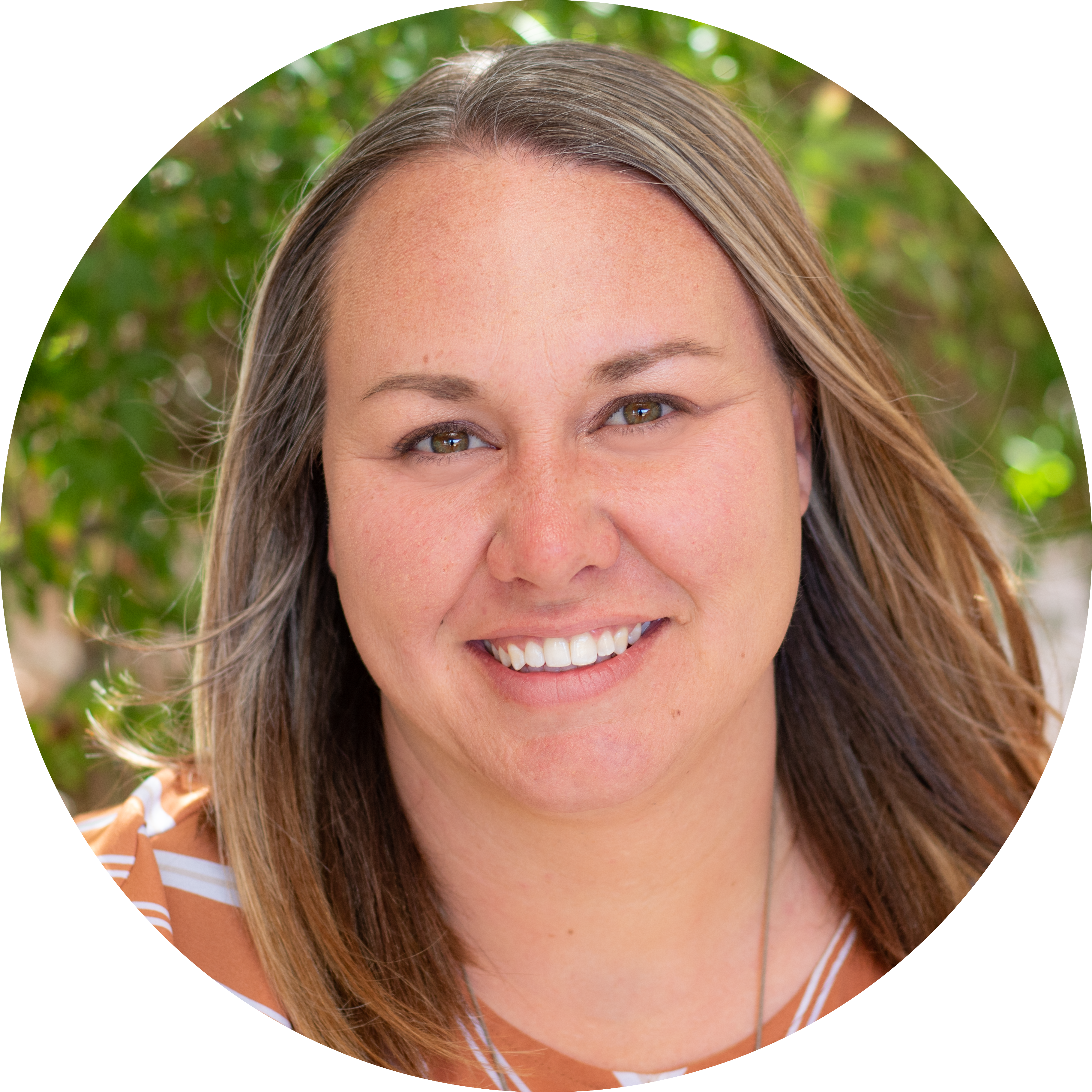 Portrait of Clare Contreras female with dark blonde hair, wearing orange and white striped shirt