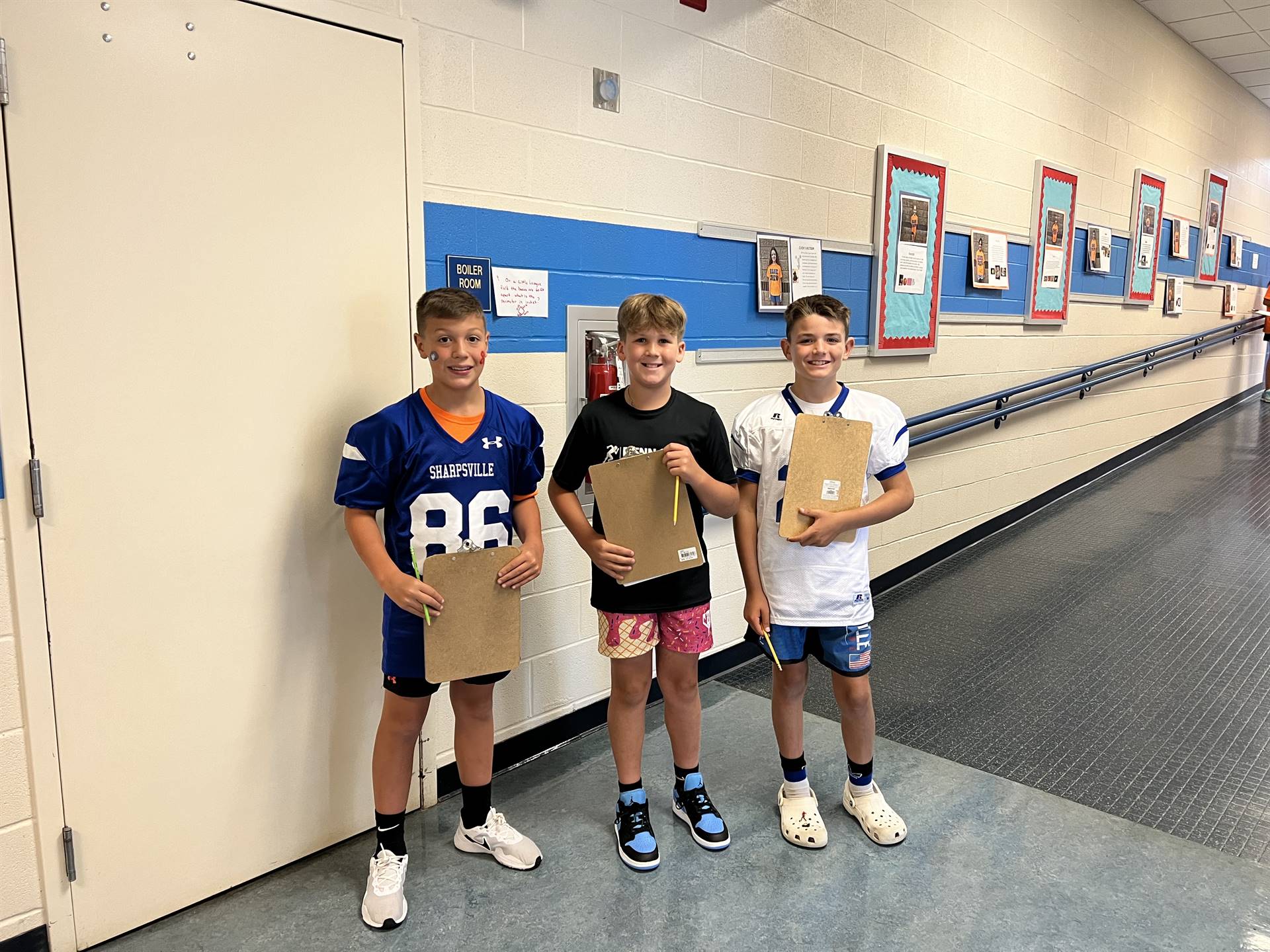 SAES Blue Crew students posing for a photo will assisting throughout the school